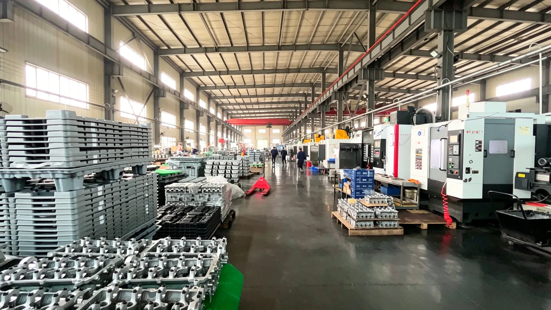 CNC machining workshop floor with multi-axis machines
