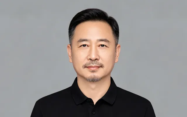 Mr. Sun Fang, CNC Process Engineer, on the production floor